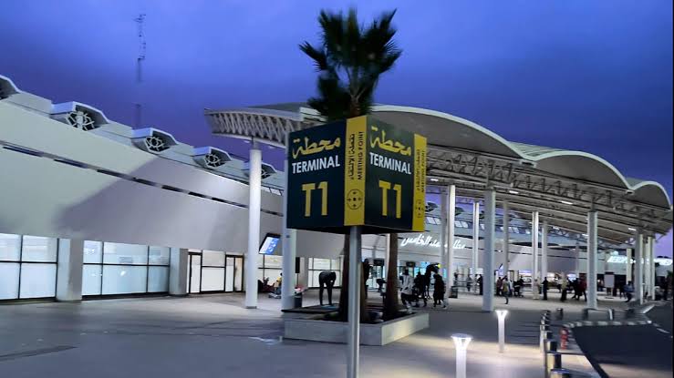 Night view of Casablanca Mohammed V Airport illuminated entrance architecture